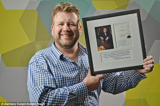Simon Rhodes with framed photo gallery